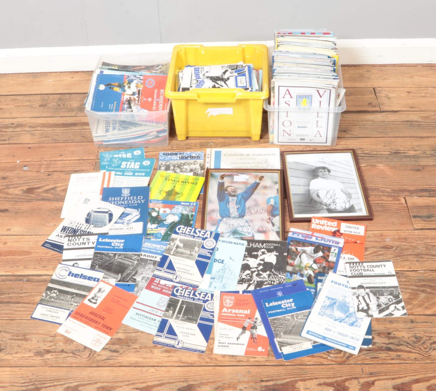 Three boxes of assorted football programmes dating between 1960 and 2010 along with two signed