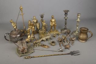 A box of assorted metal wares to include brass mining figures, silver plate candlesticks, fox door