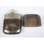 A Victorian silver hip flask, with partial crest to the front and detachable cover. Assayed for