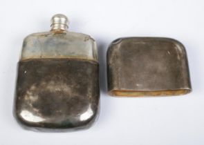 A Victorian silver hip flask, with partial crest to the front and detachable cover. Assayed for