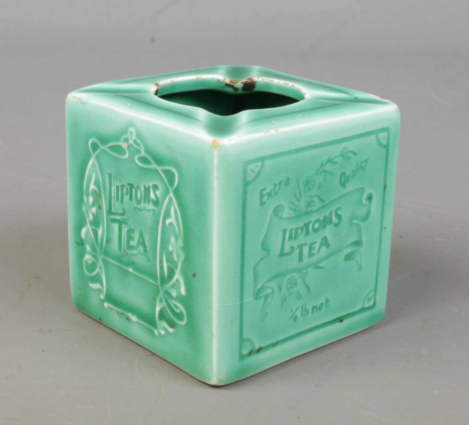 A vintage French Liptons Tea cigarette tray of cube form.