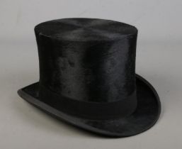 A late 19th/early 20th century moleskin top hat by Keith Scott, Dundee. 19.5cm x 15.5cm.
