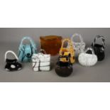 A collection of nine Luguna art glass handbags in various sizes and colours. Largest example has