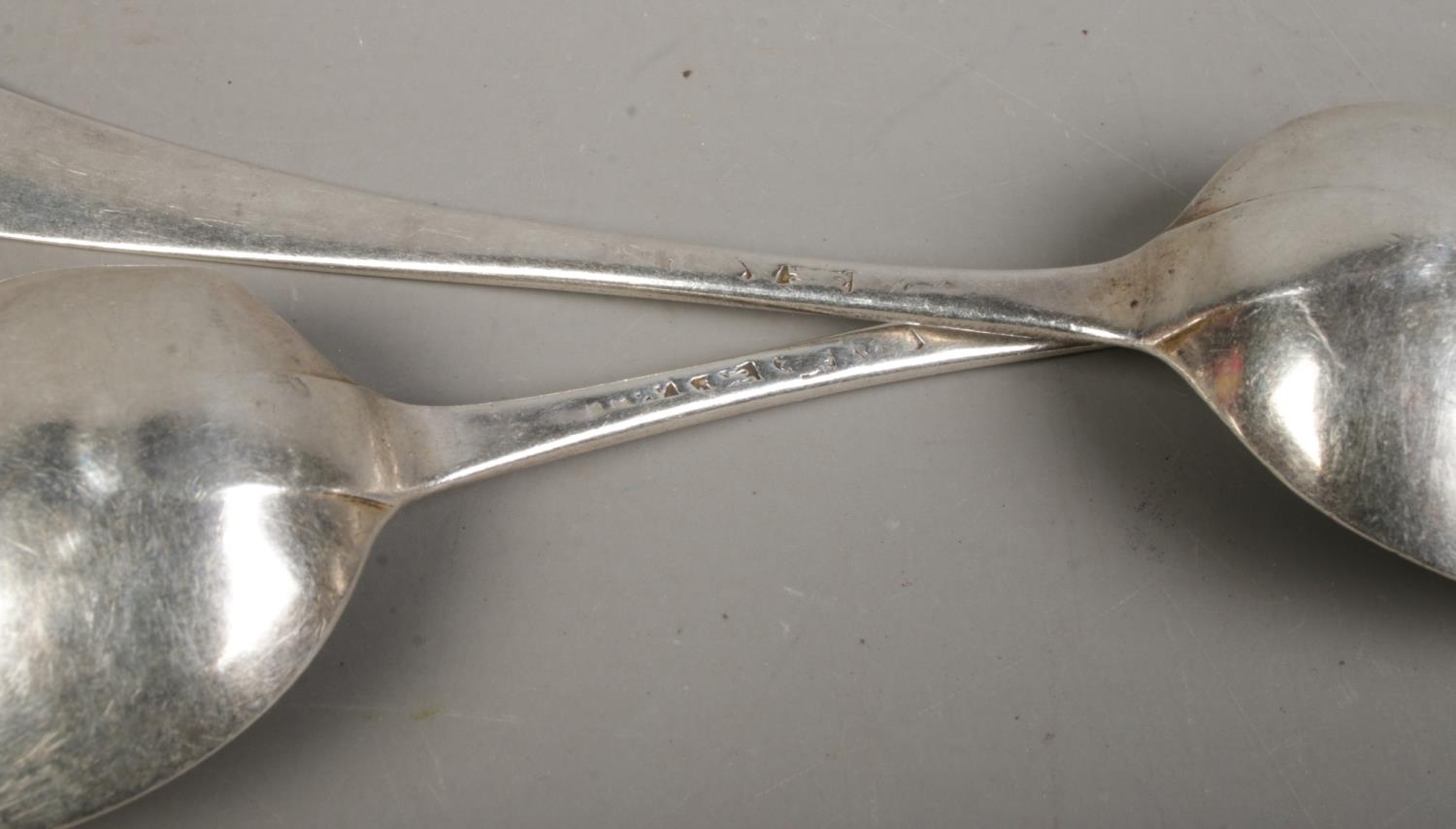 A pair of Georgian silver table spoons, with monogram to the top of the handle. Bearing partial - Image 2 of 2