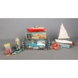 A collection of vintage toys, to include Tri-ang 8" Lugsail Dinghy and Ladybird, Leghorn Lucy and