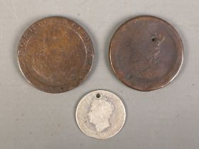 Three Georgian coins. To include two 1797 cartwheel pennies and one heavily worn silver example.
