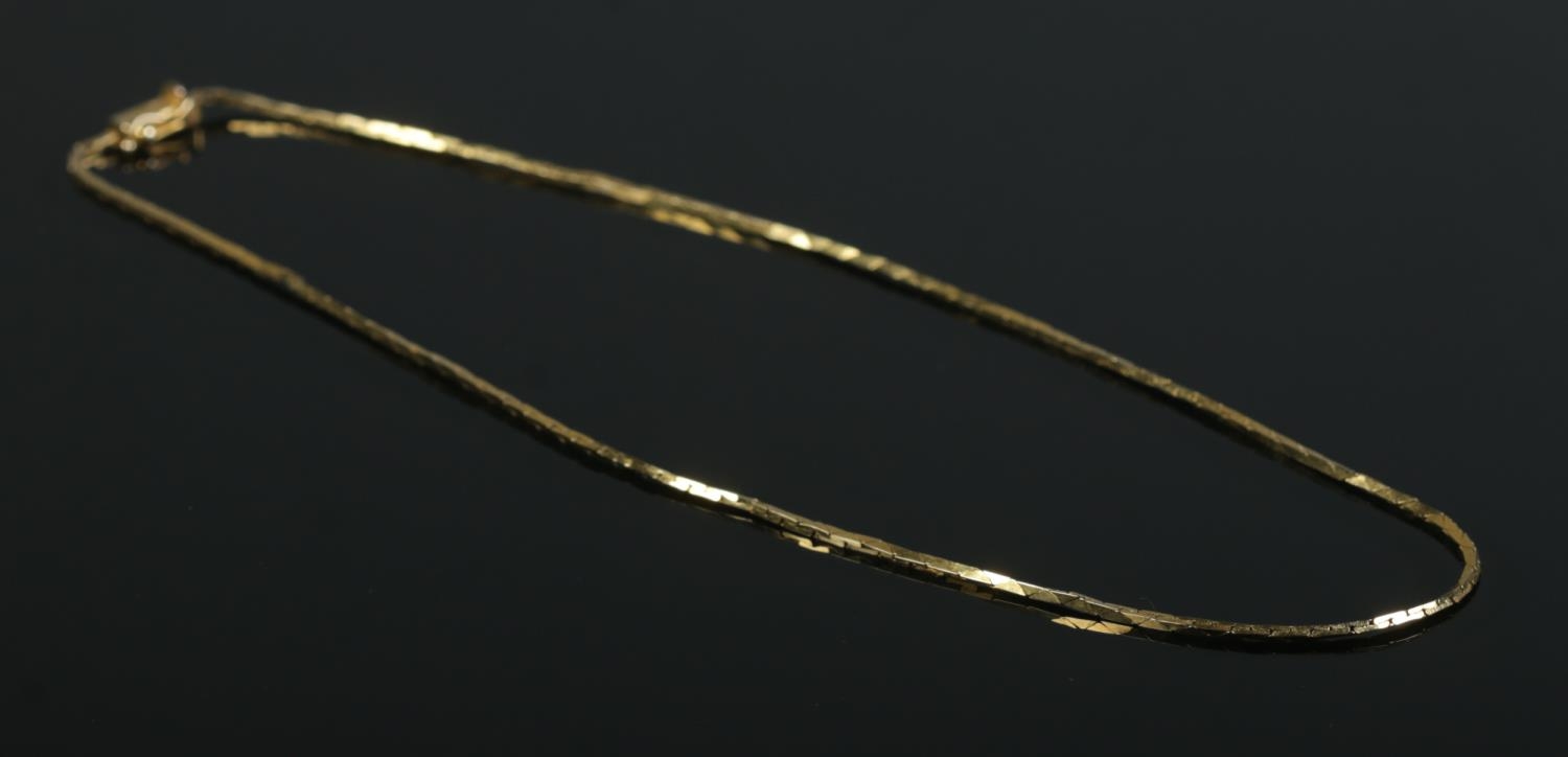 A 9ct Gold herringbone style link chain, stamped '9kt' and 375 to clasp. Length unclasped: 44cm.