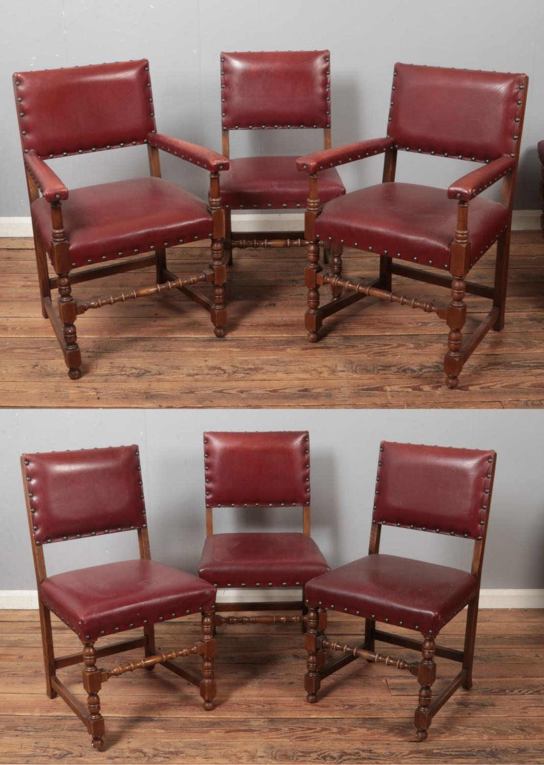 A set of six oak and red leather dining chairs. Includes two carvers.