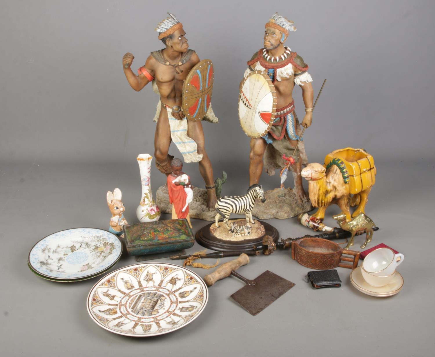 An assorted mix of collectables including large resin tribal figures, Scandinavian cup, Wedgwood and