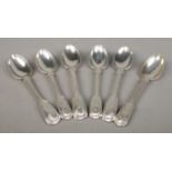 A harlequin set of six Victorian silver teaspoons with shell finial and intertwined monograms.