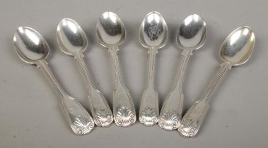 A harlequin set of six Victorian silver teaspoons with shell finial and intertwined monograms.