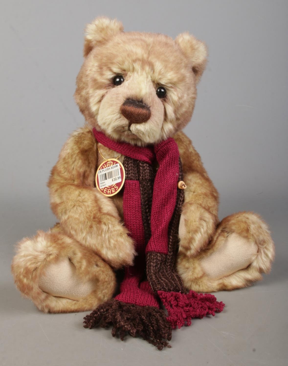 A Charlie Bears jointed teddy bear, Adam. Exclusively designed by Isabella Lee. With scarf and