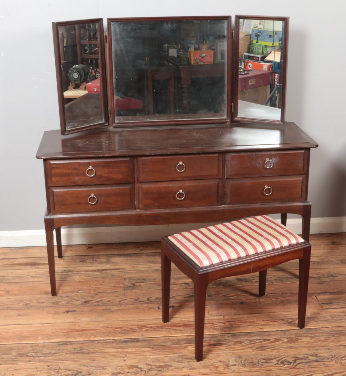 A Stag Minstrel dressing table and stool.