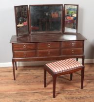 A Stag Minstrel dressing table and stool.