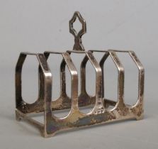 A George VI silver five bar toast rack. Assayed for Sheffield, 1939 by Emile Viner. Total weight: