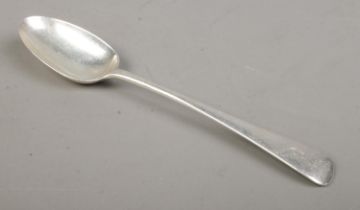 An Edwardian silver basting spoon with 'C' stenciled to the top of the handle. Assayed for