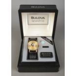 A boxed Bulova Mickey Mouse quartz wristwatch, on black 'Genuine Lizard' strap. With owner's guide