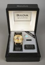 A boxed Bulova Mickey Mouse quartz wristwatch, on black 'Genuine Lizard' strap. With owner's guide