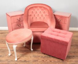 Five pieces of pink upholstered furniture. Includes pair of bedside chests, arm chair, storage box