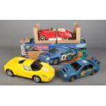 A collection of vintage cars including a Ferrari shaped cd player, remote control Subaru Impreza and