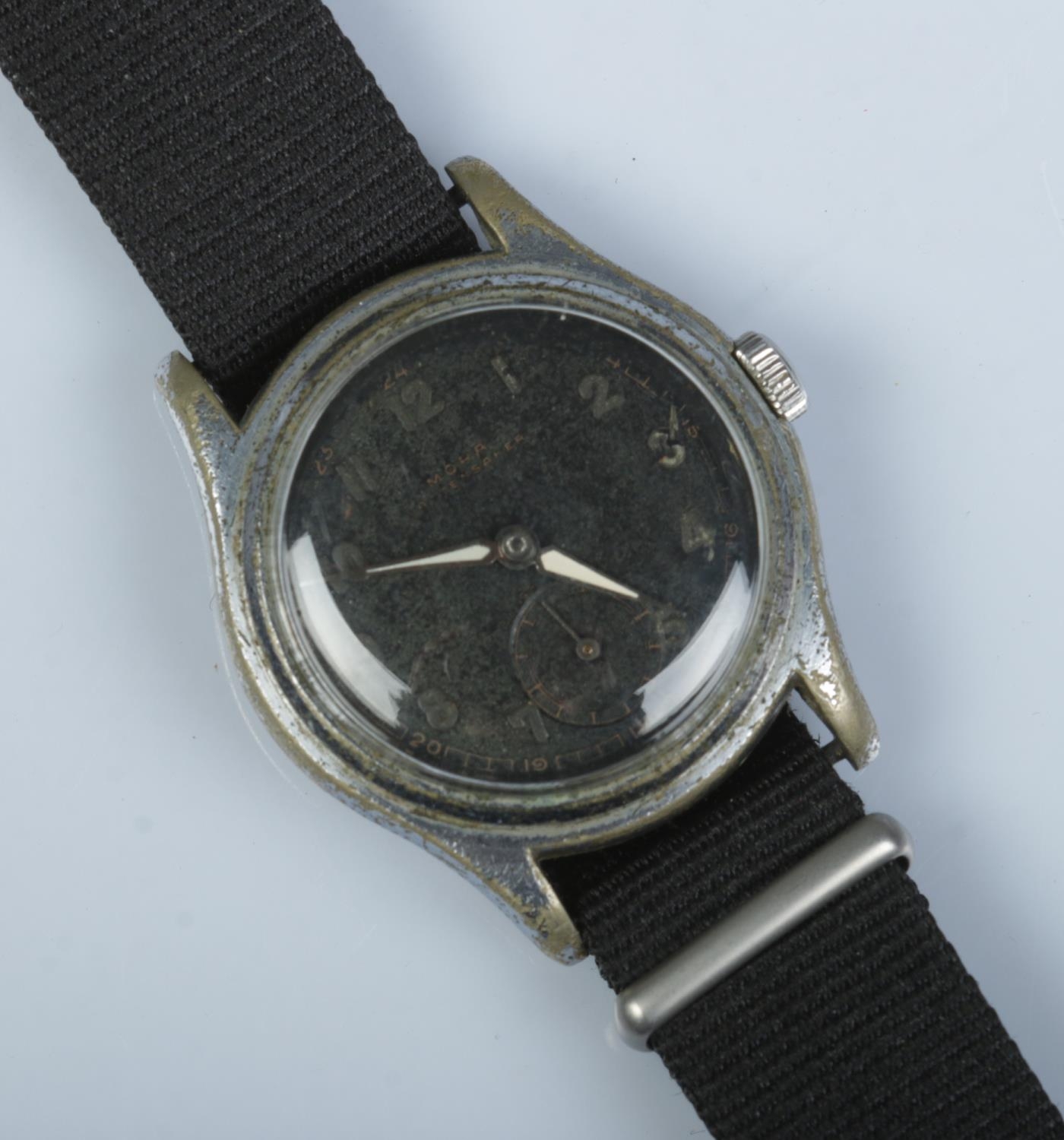 A vintage Mora stainless steel manual wristwatch. Having black dial and subsidiary seconds.