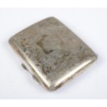 A George V hinged silver cigarette case. With scrolled decoration and monogram cartouche. Assayed