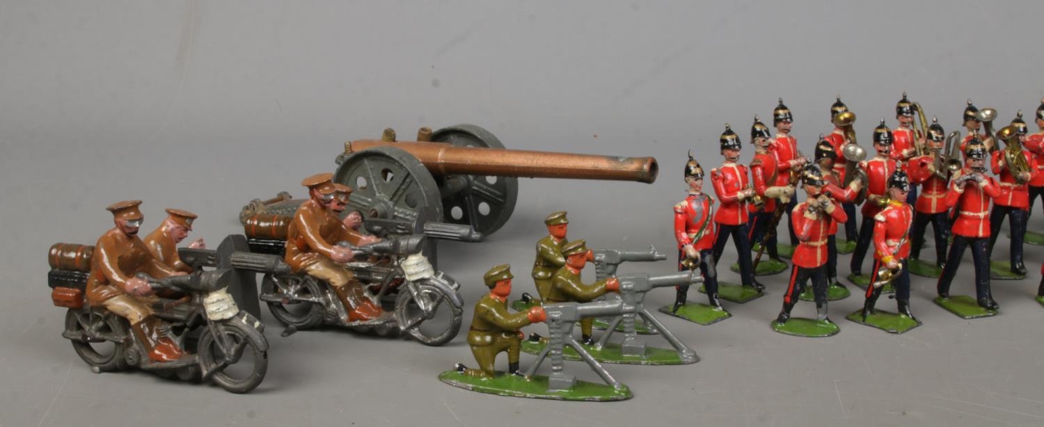 A collection of lead soldier figures, including Britains examples. Features marching band, cannons - Image 2 of 6