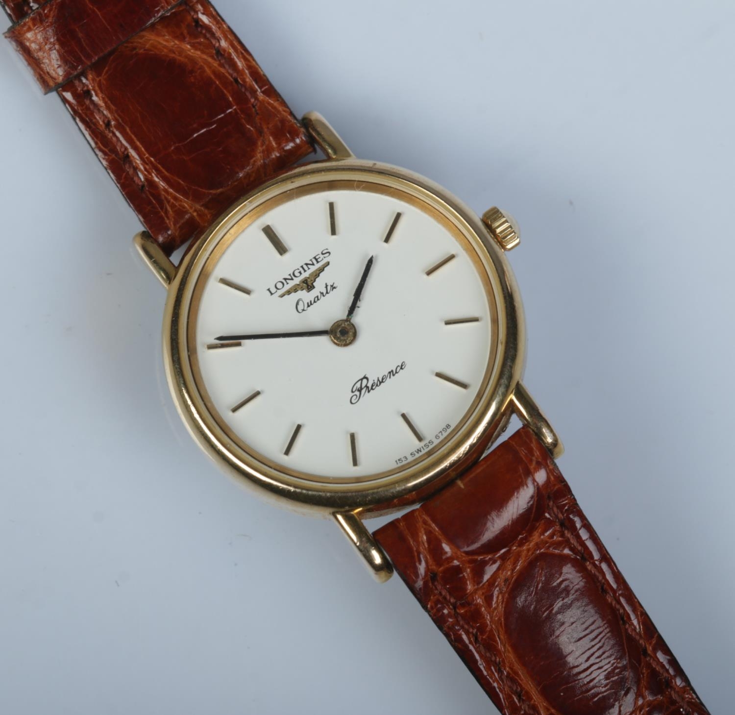 A ladies gold plated Longines Presence quartz wristwatch.