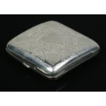 An Edwardian hinged silver cigarette case, with heavily engraved detailing to front and reverse.