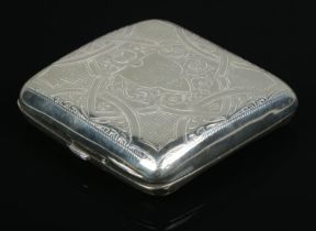 An Edwardian hinged silver cigarette case, with heavily engraved detailing to front and reverse.