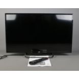 A JVC LT-32C490 32" LED HD TV, with remote and booklet.
