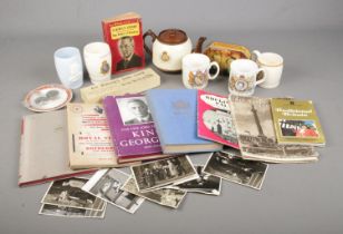 A box of assorted royal memorabilia including various mugs, royal books, photo's, coins/medals etc