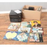 A Crown Deluxe hi-fi music center along with collection of vinyl records to include Elvis, ABBA, The