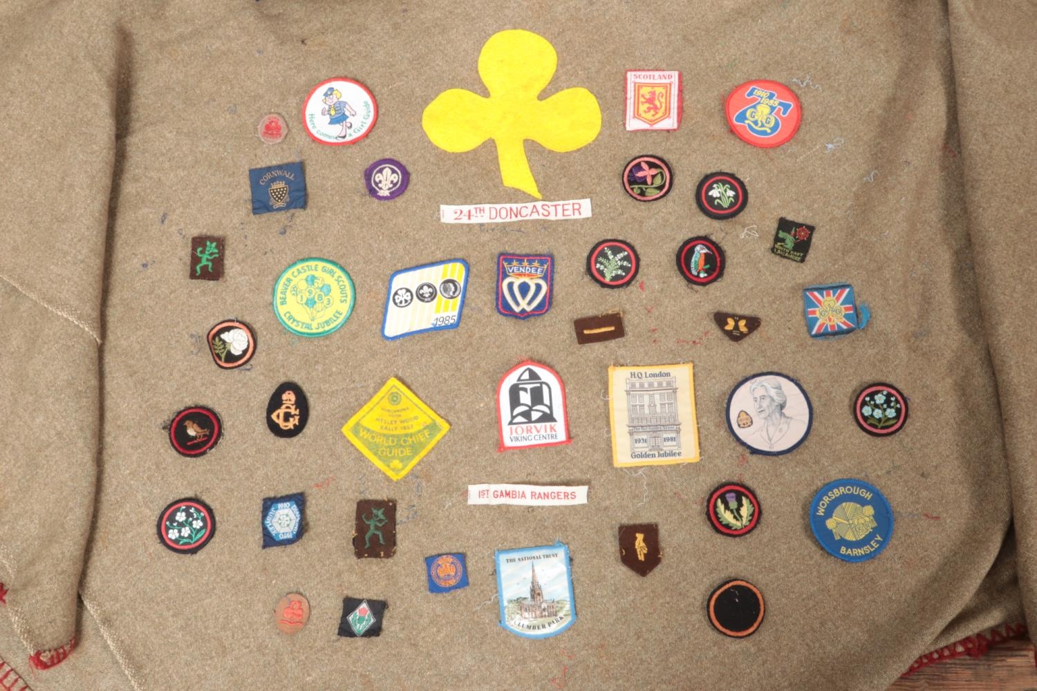 A vintage girl guides poncho, with a large collection of badges and two berets. - Image 2 of 5
