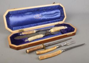 A cased three piece Joseph Rodgers bone handled carving set, together with one other uncased