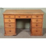 A satinwood twin pedestal desk. Hx73cm Wx123cm Dx59cm Previously house in a workshop with related