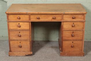 A satinwood twin pedestal desk. Hx73cm Wx123cm Dx59cm Previously house in a workshop with related