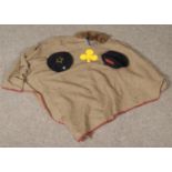 A vintage girl guides poncho along with two berets.