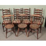 A set of four ladder back chairs with another three stick back chairs