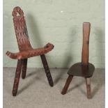 Two spinning chairs one have carved detail one chair in need of restoration