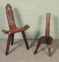 Two spinning chairs one have carved detail one chair in need of restoration