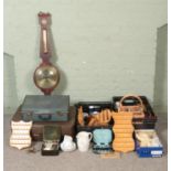 Two boxes of assorted miscellaneous, to include barometer, vintage suitcases, thimble display