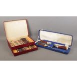 Two cased sets of bone handled cutlery, to include six place knife and fork set bearing Taylor's