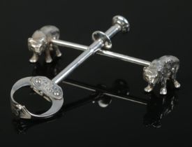 Two pieces of WMF silver plate, consisting of a knife rest formed as bears and a set of sugar tongs.
