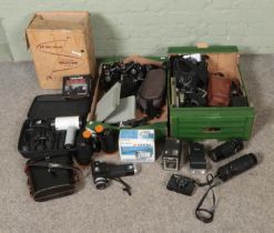 Two boxes of mostly photographic equipment to include Kodak Brownie, Technar binoculars, film reels,