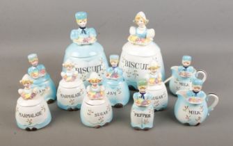 A collection of Dutch style ceramics of lidded boys/girls each being labelled a different food