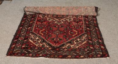 Two large rugs including one of geometric design. 210cm x 140cm and 315cm x 205cm. One fading,