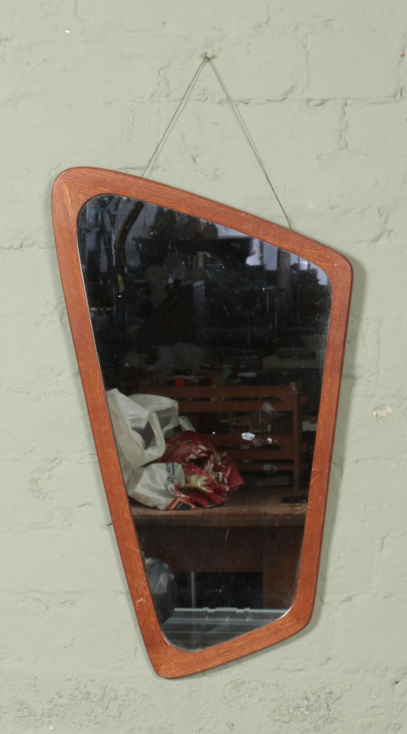 Clark Eaton teak framed asymmetrical mirror. Approx. dimensions 64cm x 37cm.