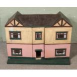 A very large vintage dolls house with fold away open front