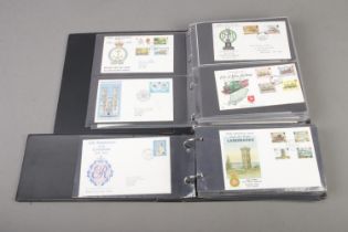 Two albums of Isle of man first day covers, 148 examples.